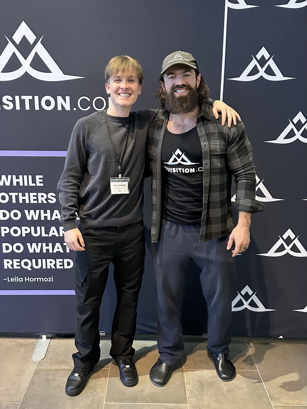Jake Trinder with Alex Hormozi at Acquisition.com